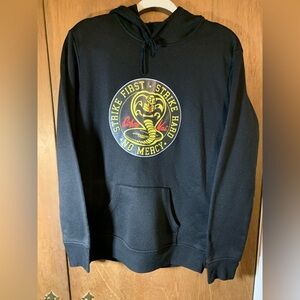 Youth black and yellow Cobra Kai Hoodie, size Xtra Large.